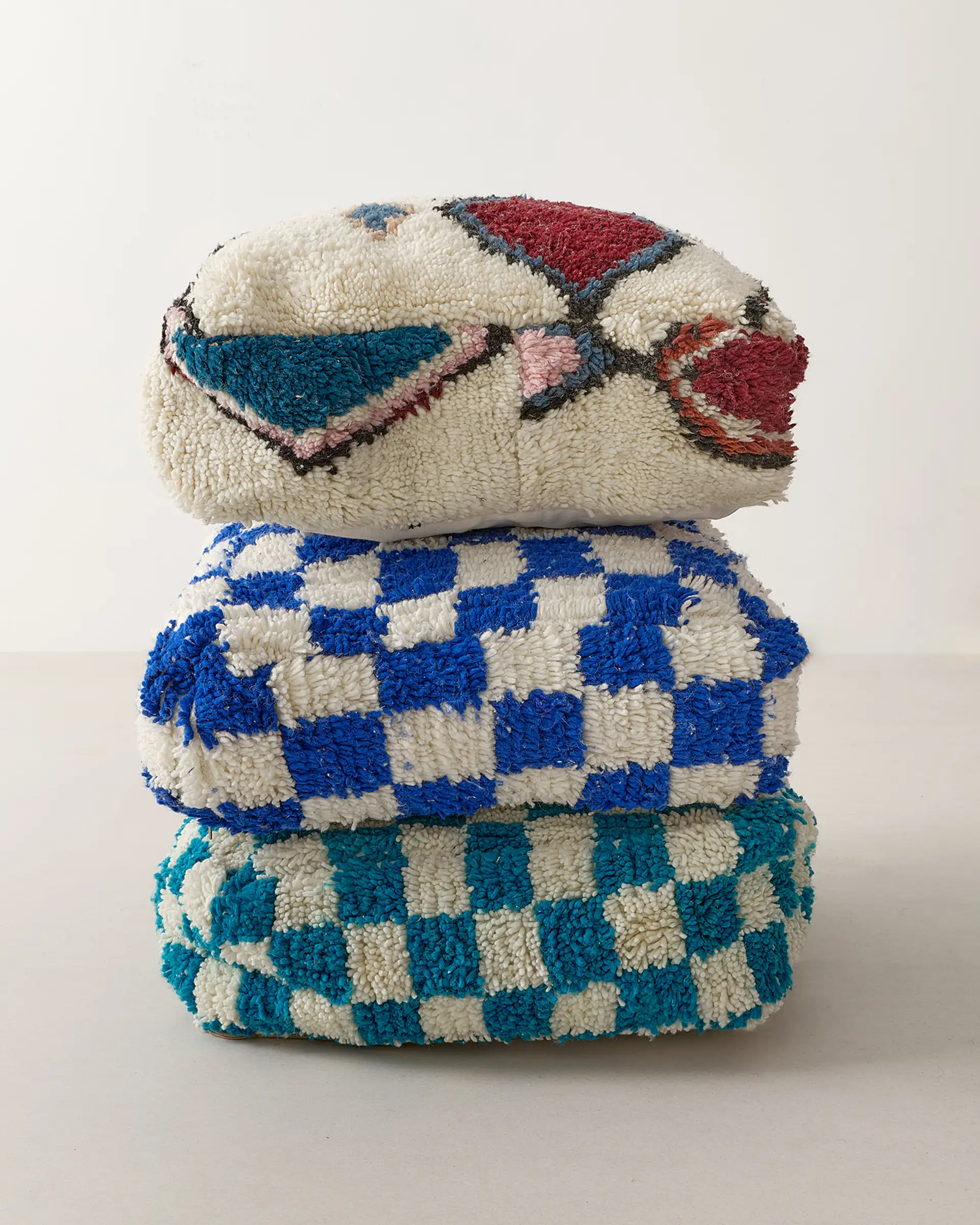 Turquoise checkered pouf trio