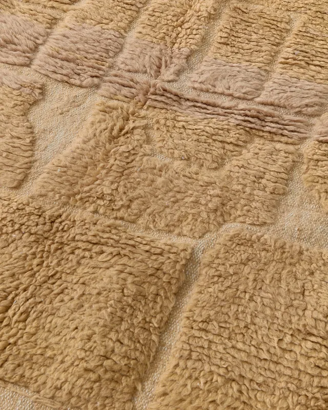 Tiny warm brown labyrinth rug close-up