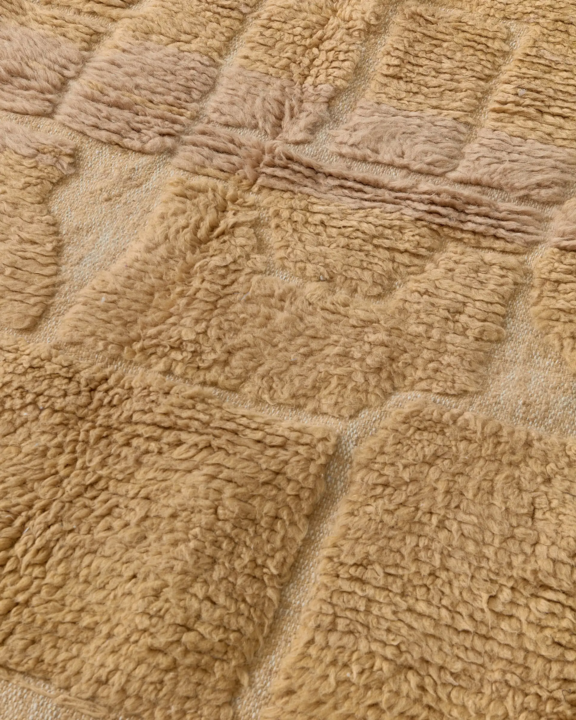 Tiny warm brown labyrinth rug close-up