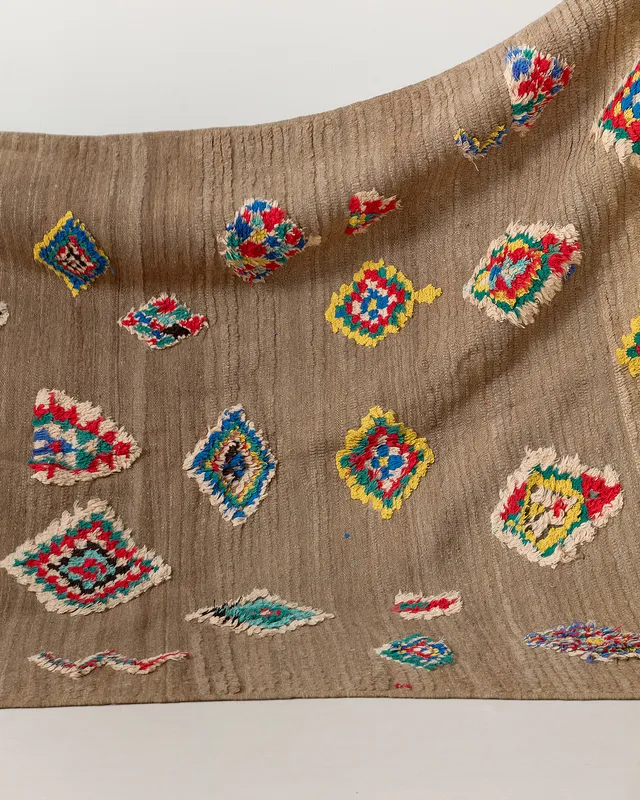 Vintage rug with floating motifs, close up