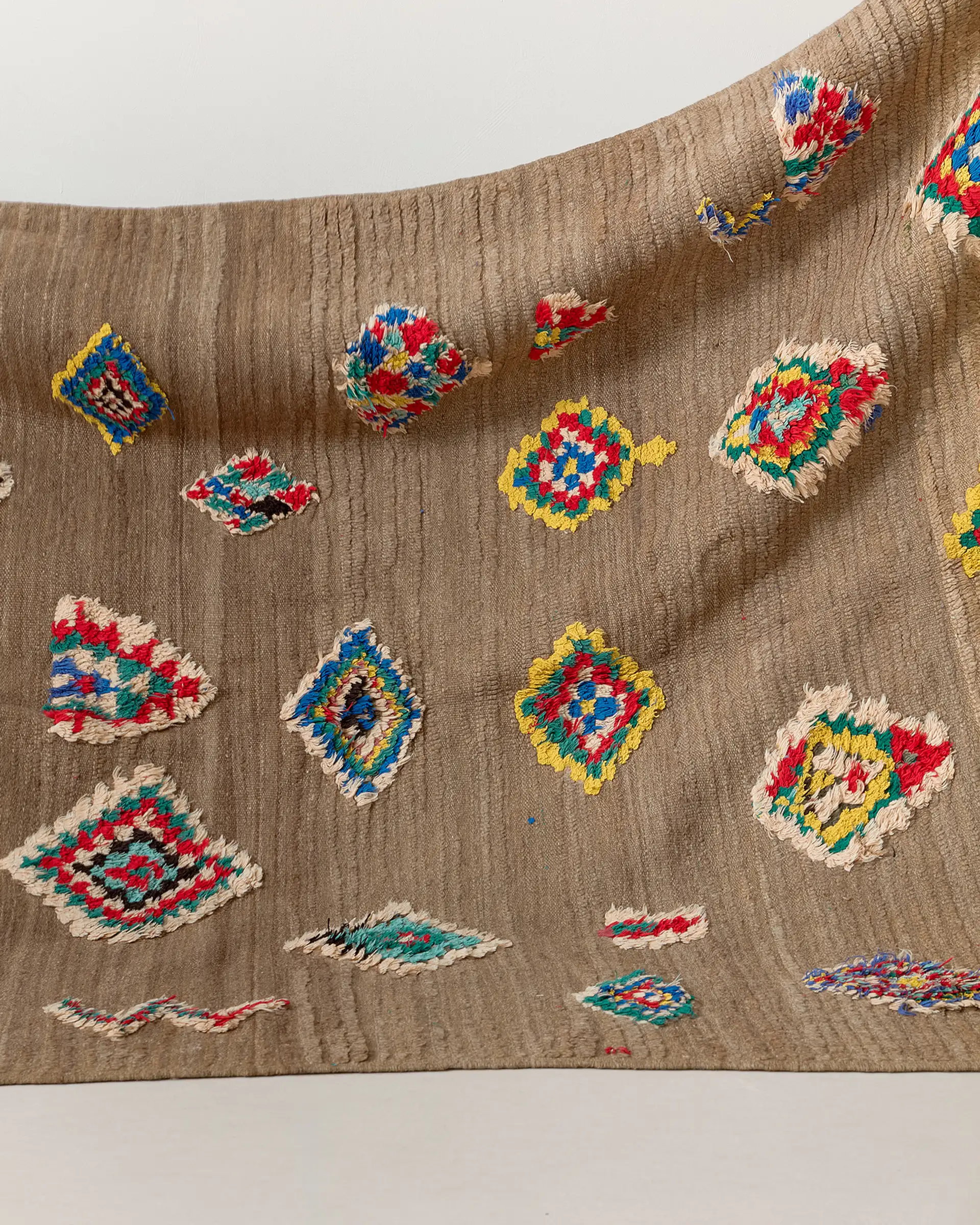 Vintage rug with floating motifs, close up