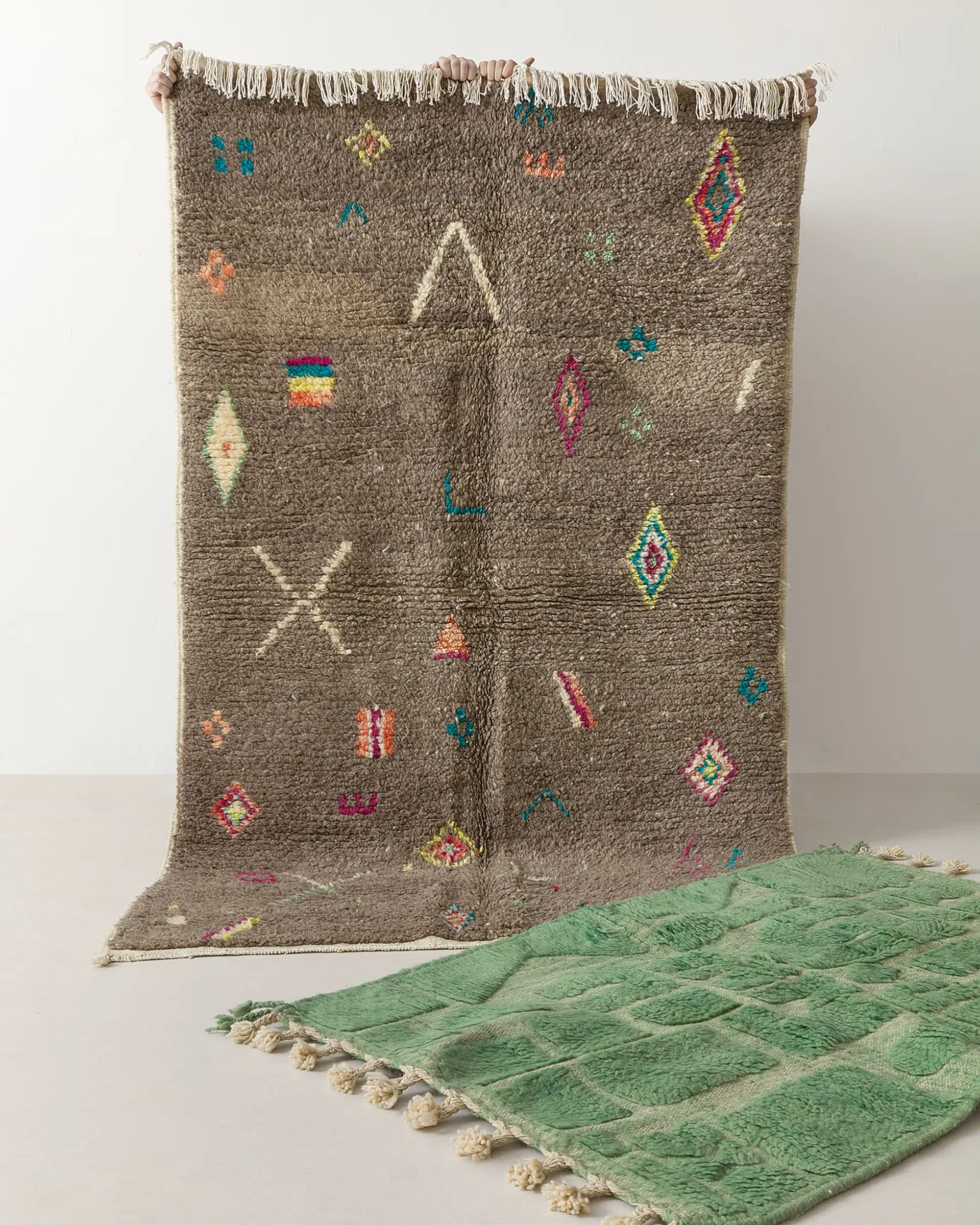Grey and green rugs